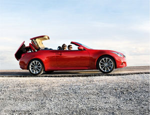 Red 2009 Infiniti G37 convertible top moving