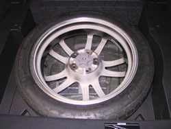 Spare tire kit for 2009 through 2012 Infiniti G37 convertibles image showing spare tire mounted